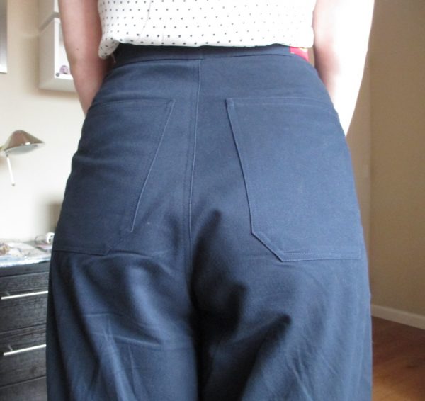 The back has a pair of long, high-placed pockets.