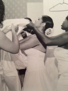 It takes a village to put on a wedding gown.  