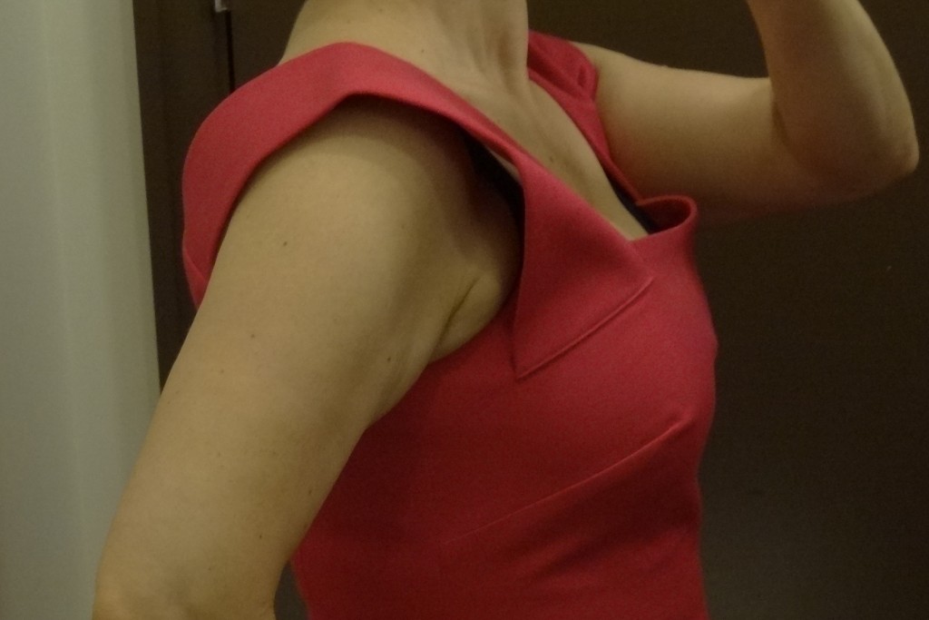 working with cleavage in roland mouret pink strappy sheath pull up straps