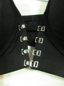 You can wear the front closed all the way, or leave one or two clips open to make it a deeper plunge.