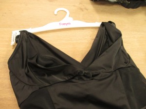 A closeup of the top portion, which is basically just side slings. So you can wear any bra, and the side slings will bring your boobs in for some nice cleavage. The sample did not have adjustable straps, but here’s hoping the final product will!