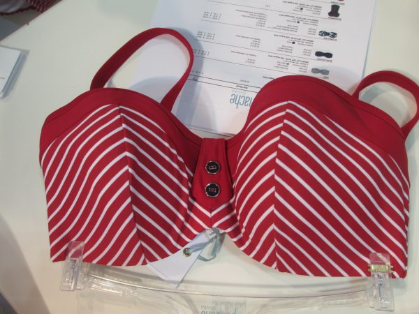 Fan favorite Britt is back in a dark red with white stripes and button details. Choices include this bandeau top (30-38 D-G), a halter bikini (30-38 D-H), halter tankini (30-38 D-H), and two swim bottom styles.