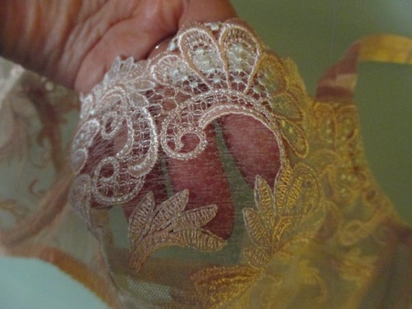Look how delicate the fabric is on the upper portion of the cup under the embroidery. Yet still strong, somehow!